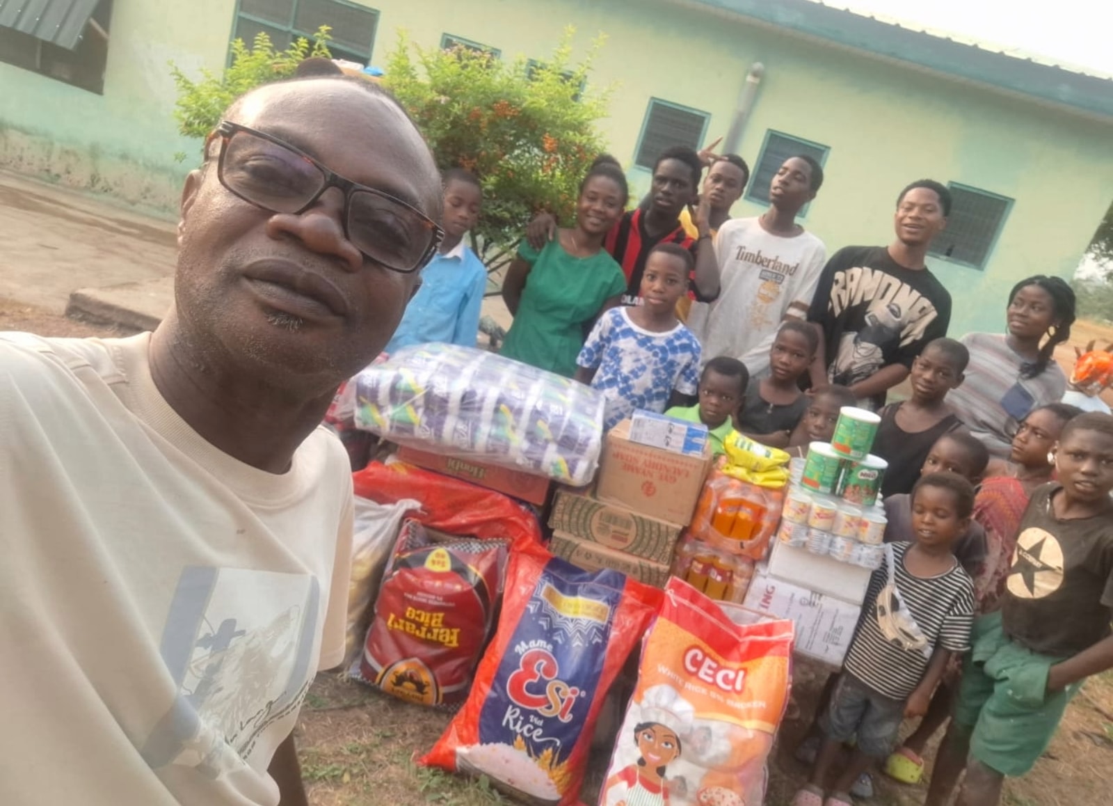 Staff and children on another donation day