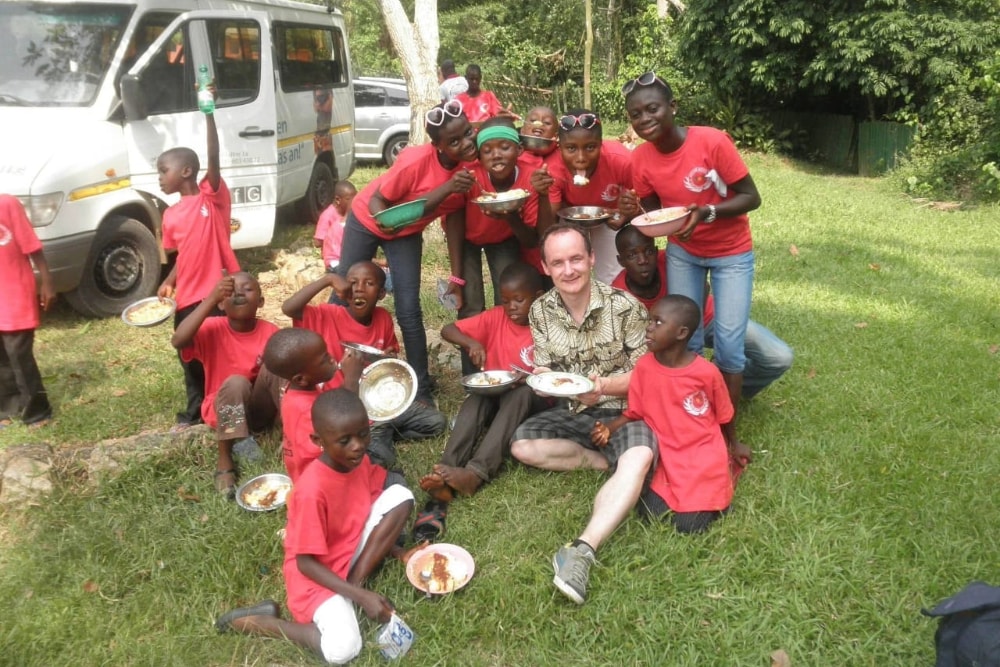Mealtime with the children and a visiting volunteer