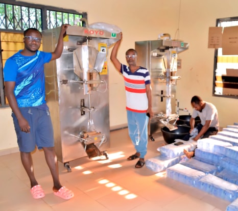 Staff operating the sachet water packaging machine