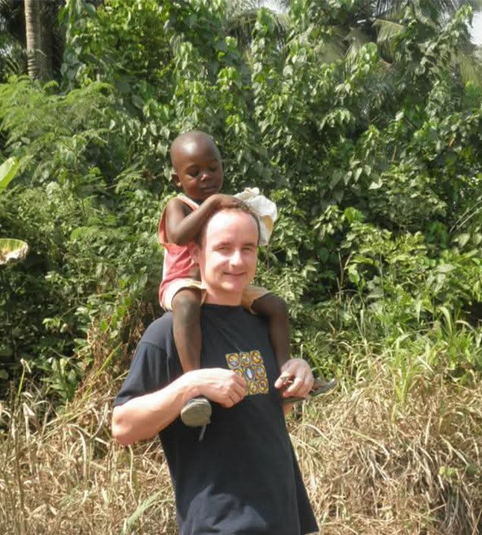 A volunteer spending time with a child at United Hearts Foundation